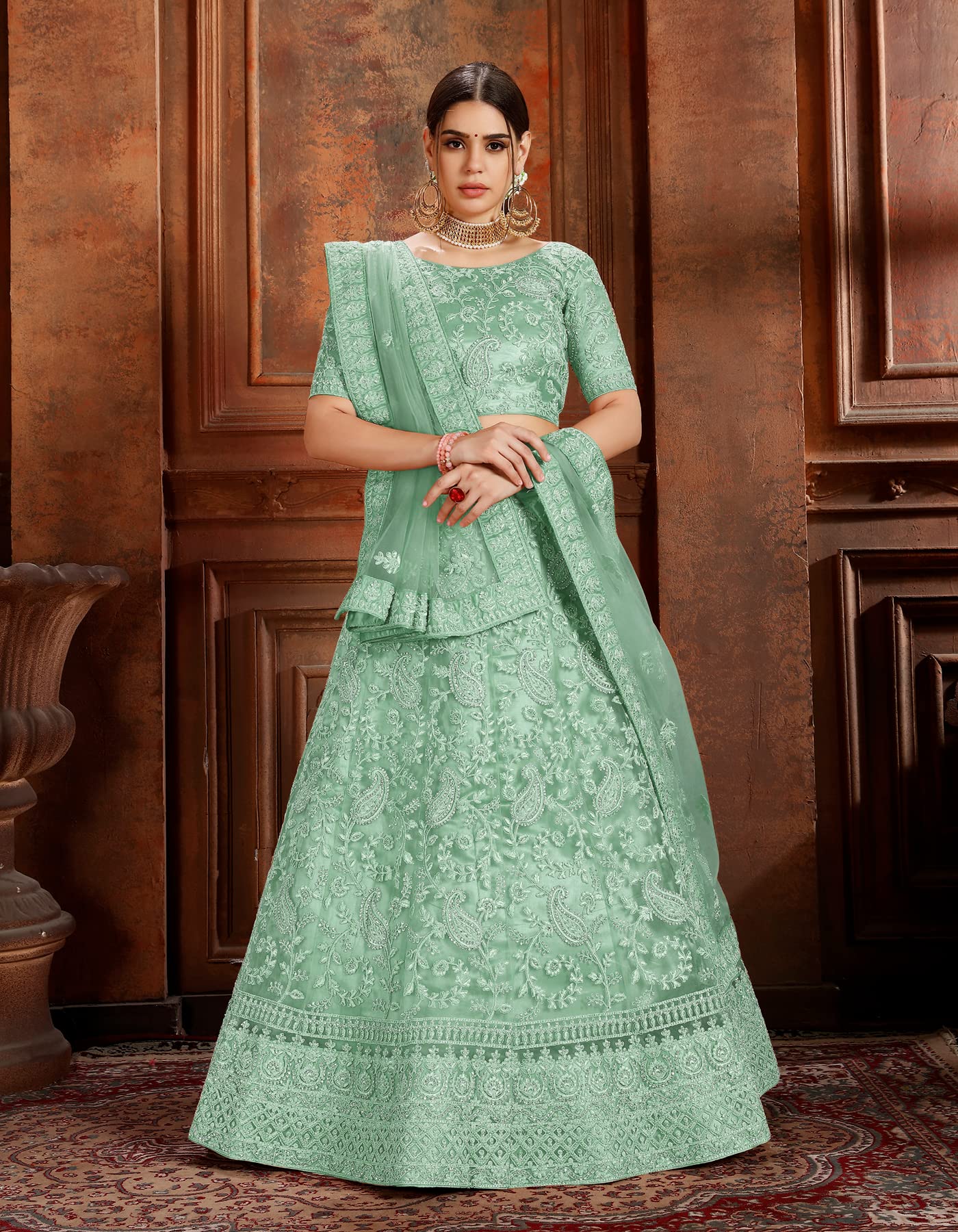 FUSIONIC Fascinating zarkan and pearl work base green lehenga choli For Women