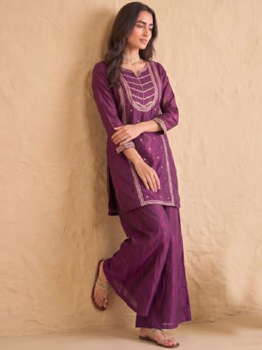 wine embroidered kurta set paired with a shimmering organza dupatta.