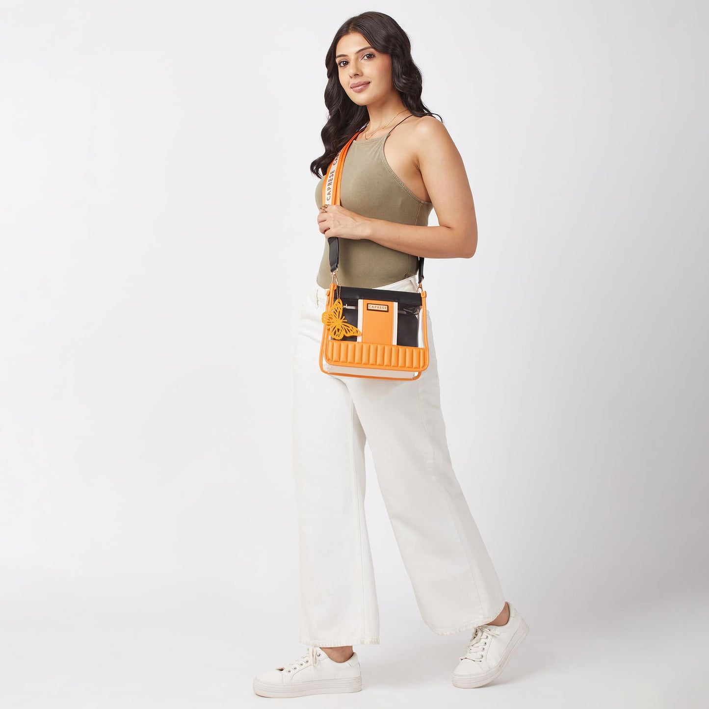 Caprese Madonna Sling Bag Medium | Transparent Crossbody Handbag with Butterfly Charm for Women with Adjustable & Detachable Sling Strap, Zip Closure| Shoulder Bag | Perfect for Casual Use (Amber)