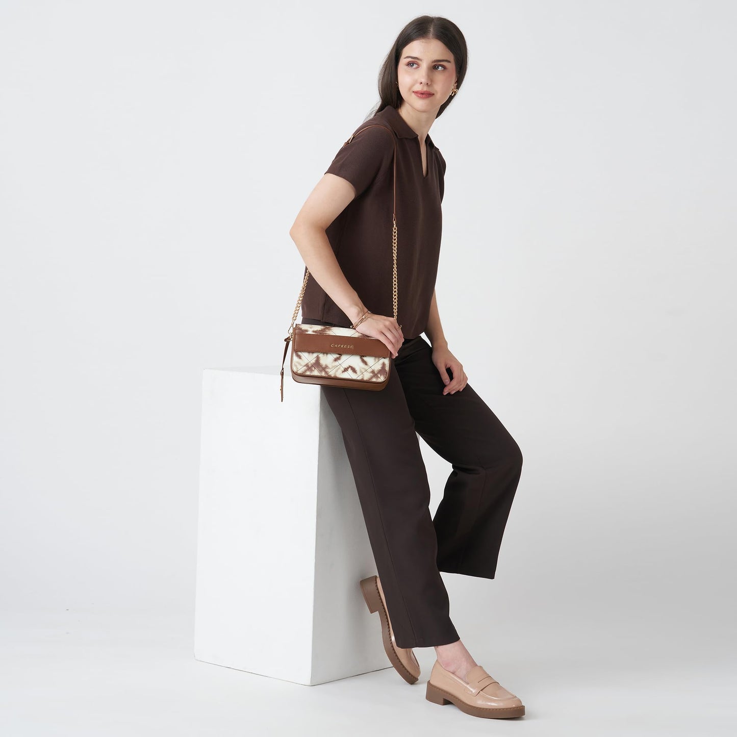 Caprese Shibori Medium Sling Bag for Women with Adjustable & Detachable Strap | Printed Faux Leather Shoulder Bag with Multi-Compartments | Zipper & Magnetic Button | Detachable Charm (Brown)