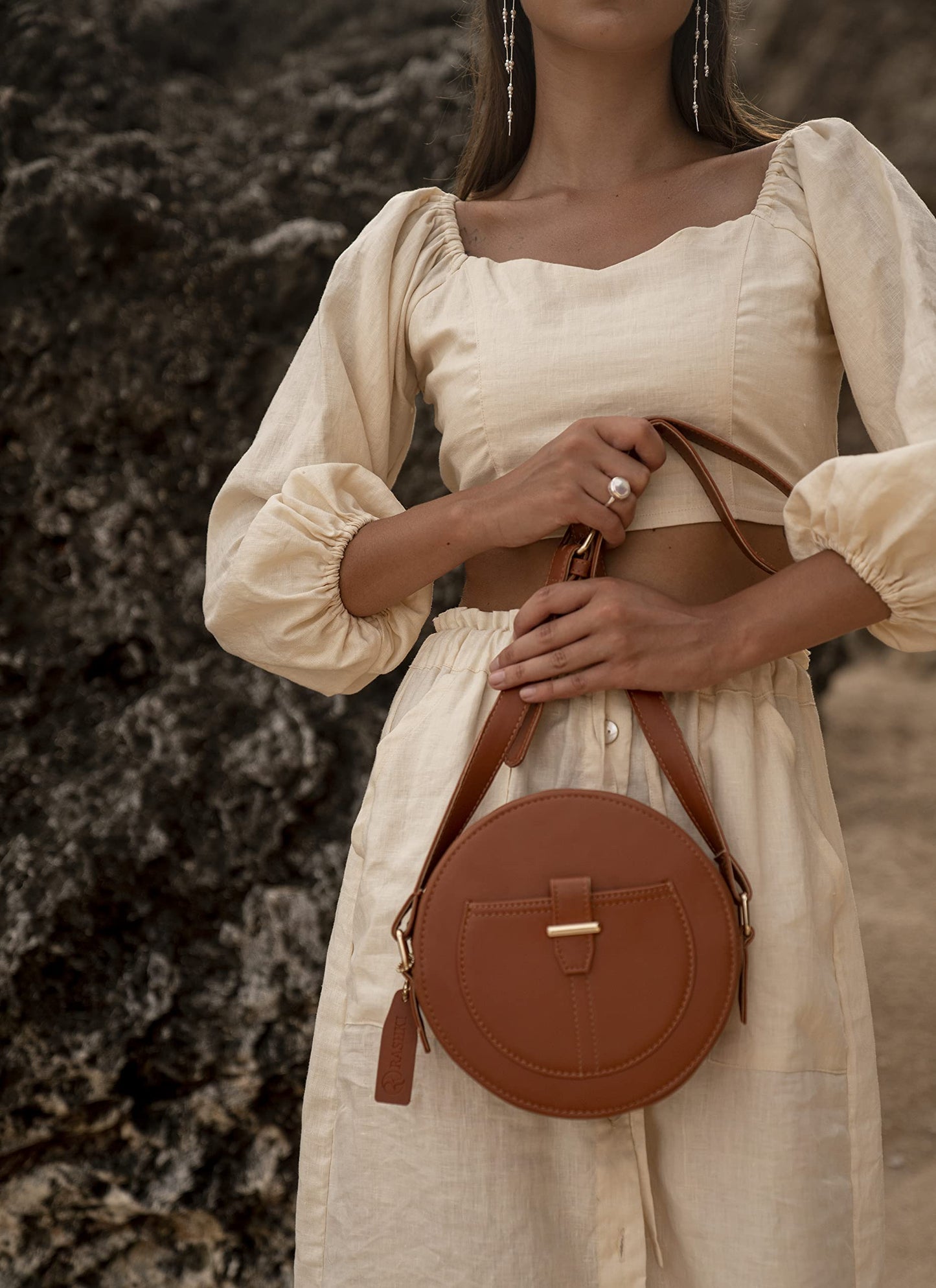 RASHKI TERRA - Womens Vegan Leather Sling Bag| Spacious Compartment| Perfect for Daily Use| Travel | Party| Round Bag | Zipper closure (TAN)