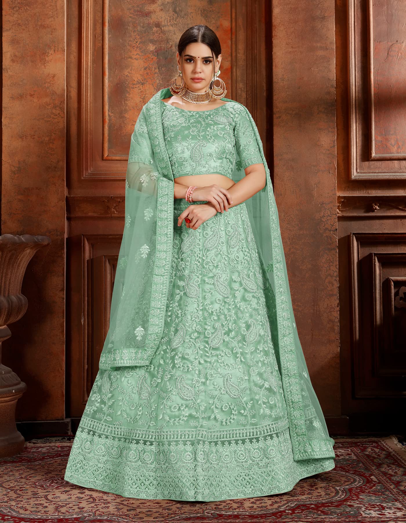 FUSIONIC Fascinating zarkan and pearl work base green lehenga choli For Women