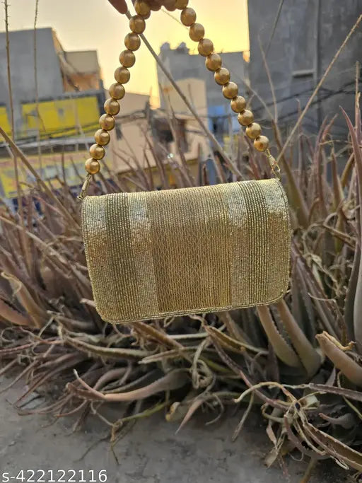 Gold foldover handbag