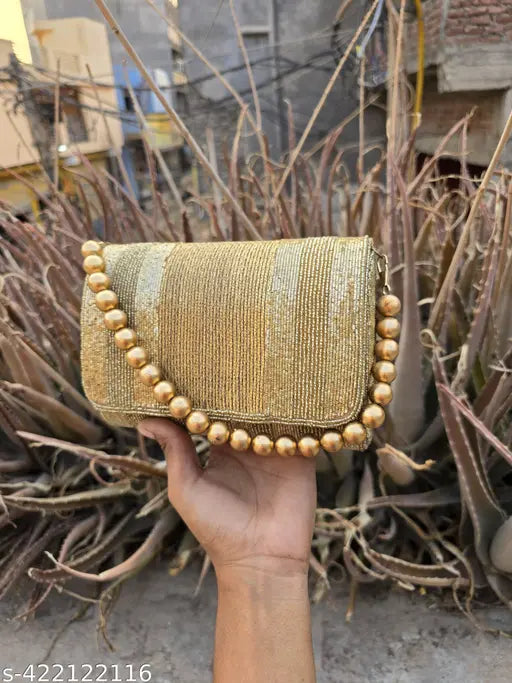 Gold foldover handbag