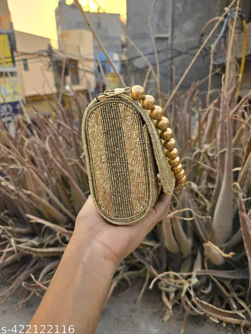 Gold foldover handbag